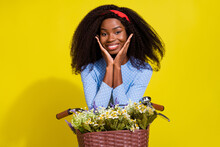 Photo Of Young Girlish Afro America Woman Wear Dotted Blue Dress Bike Hands Cheeks Isolated On Yellow Color Background