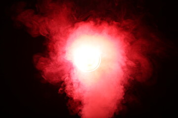 Poster - Artificial magic smoke in red light on black background