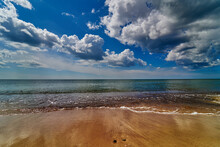 Panoramic Dramatic Sunset Sky And Tropical Sea At Dusk. Beach Sand, Sea And Blue Sky With Clouds