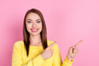 © deagreez - Portrait of attractive cheerful girl demonstrating copy empty space ad solution isolated over pastel pink color background