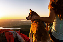 Woman With Dog Overlooking The Sunrise At Horsetooth, Colorado