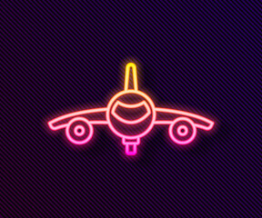 Sticker - Glowing neon line Plane icon isolated on black background. Flying airplane icon. Airliner sign. Vector