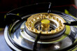 © kanpisut - New brass gas stove burners. Brass burner stand on a rusty gas stove. New gas stove the necessary kitchenware for your home