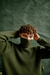 © Anna Artemenko/Stocksy - close-up portrait of a young curly guy