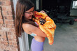 © Jessica Klaus/Stocksy - Raccoon wrapped in a beach towel.