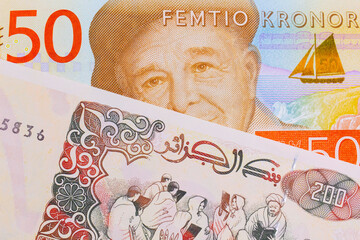 Wall Mural - A macro image of a gray and orange fifty kronor note from Sweden paired up with a beige 200 Algerian dinar bank note.  Shot close up in macro.