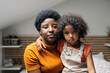 © Santi Nuñez/Stocksy - Black Woman with her Daughter Portrait