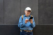 © Santi Nuñez/Stocksy - Boomer Man Using Phone in the City