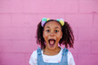 © Erin Brant/Stocksy - Happy girl with mouth wide open