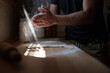 © Malquerida Studio/Stocksy - Man cooking a homemade pizza dough