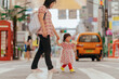 © Pansfun Images/Stocksy - Mother took the little girl across the road