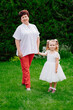© andrey - old mother with a little daughter in the garden. late pregnancy and childbirth.