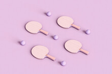 Ping Pong Rackets On Violet Background