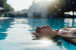 © Mattia/Stocksy - Woman Relaxing on a Swimming Pool