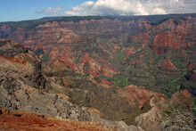 Viewpoint  Looking Out At Colorful, Eroded Waimea Canyon And Rain Forests In Kauai, Hawaii