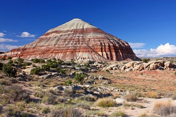 Wall Mural - Colorful red   striations in the bentonite hills on a sunny day in the cathedral valley loop of  capitol reef park, utah