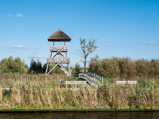 Wall Mural - Watch tower with viewing platform in national park Alde Feanen, Friesland, Netherlands