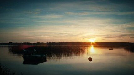 Wall Mural - Boats on water on the background of sunset
