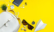 Leinwandbild Motiv Summer travel concept. Traveler's accessories. Passport, money, sunglasses on a yellow background. Flatlay.