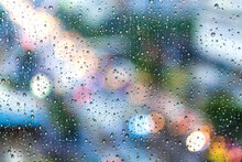 Full Frame Shot Of Raindrops On Glass Window