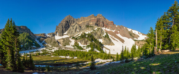 Wall Mural - volcanic mountain in morning light under blue sky.