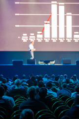 audience listening to financial lecture