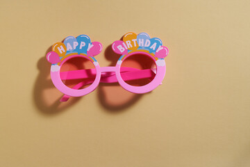 happy birthday party eyewear  on orange background