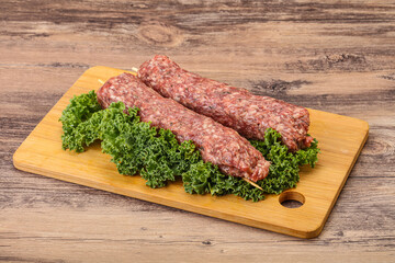 Raw minced beef kebab skewer