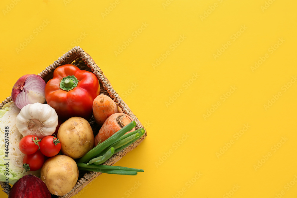 Wicker basket with ingredients for preparing borscht on color background