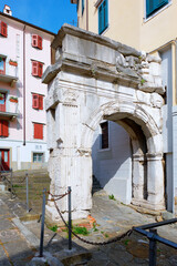 Wall Mural - Ancient roman city entrance gate,  in the old city center of Trieste (Northern Italy, Friuli Region).