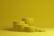 Stepped pedestal of six yellow cylinders in studio lighting on yellow background. 3d render.