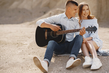 Young couple in love in sand career