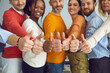 © Studio Romantic - Group of different senior and young people giving thumbs up. Dream team of smiling friends, colleagues or business partners doing like gesture, hands closeup. Satisfaction, successful teamwork concept