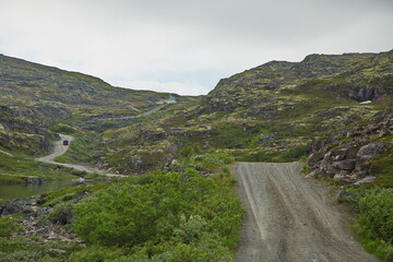 Mountain road through the pass in the Kola tundra, Murmansk region of Russia.