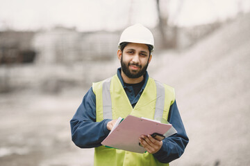 Civil engineer working outside with helmet