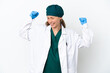 © luismolinero - Surgeon caucasian woman in green uniform isolated on white background celebrating a victory