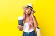 © luismolinero - Young mixed race woman holding passport and beach bag isolated on yellow background with headache
