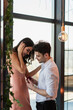 © LIGHTFIELD STUDIOS - happy man making proposal to girlfriend in slip dress