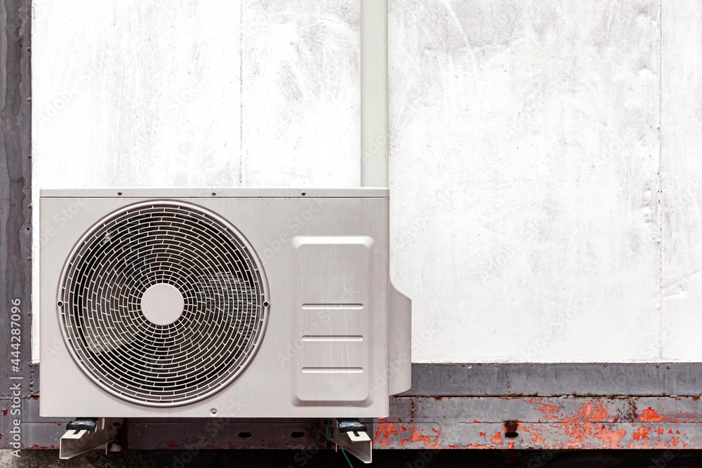 Air conditioner compressor outdoor unit installed outside the building ...