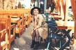 © kuzmichstudio - Young adult beautiful woman in casual clothes in a city street cafe