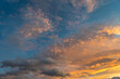 warm orange and blue sky at sunset scenic clouds background