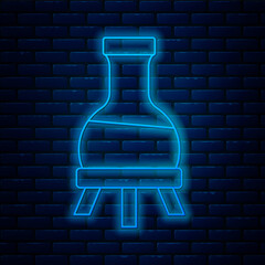 Glowing neon line Test tube and flask chemical laboratory test icon isolated on brick wall background. Laboratory glassware sign. Vector