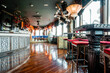 © ADDICTIVE STOCK - Interior of spacious bar at daytime