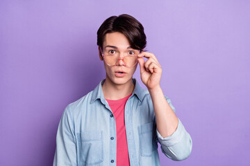 Poster - Photo of young guy amazed shocked surprised omg wow reaction hand touch glasses isolated over purple color background