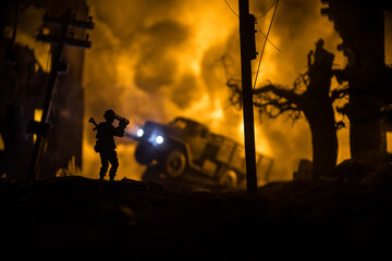 Military soldier silhouette with bazooka. War Concept. Military silhouettes fighting scene on war fog sky background, Soldier Silhouette aiming to the target at night.