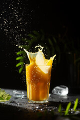 Wall Mural - Non-alcoholic cooling drink with splashes and drops