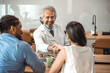 © Dragana Gordic - Doctor shaking hands with woman. Female patient visiting health professional. They are in hospital. Cropped shot of a handsome mature male doctor and his patient shaking hands in the hospital
