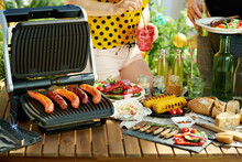 Desk With Electric Grill And Grilled Sausages