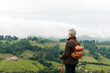 © ADDICTIVE STOCK - Unrecognizable senior female traveler standing in mountain