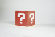 Red Metal Toy Blocks With A Question Mark
